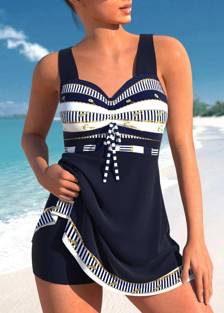 Women navy and white striped sleeveless swimsuit with ruched tie front and mini skirt over shorts on beach